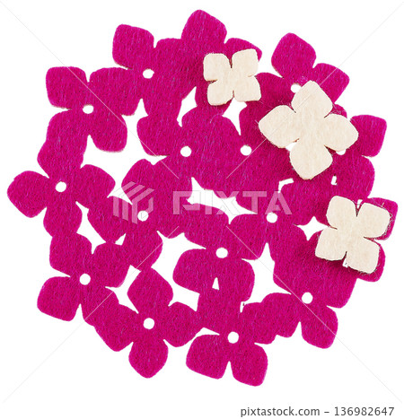 Magenta pink felt floral coaster cut out on white background Magenta pink felt floral coaster cut out on white background 136982647