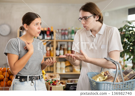 Wife and husband shout at each other, insult and accuse, express dissatisfaction Wife and husband shout at each other, insult and accuse, express dissatisfaction 136982740