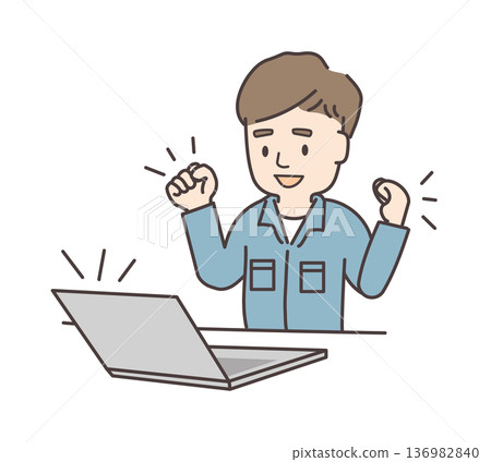 A young man in work clothes making a fist pump in front of a computer 136982840