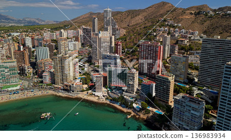 Aerial view of Benidorm coastline with modern high rise buildings and turquoise Mediterranean sea Spain 136983934