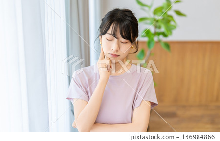 A woman thinking about health and diet A woman thinking about health and diet 136984866