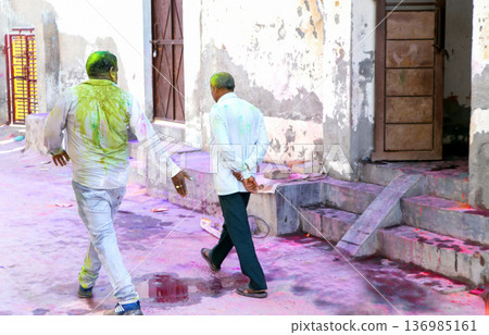 Indian Men Walking After Holi Celebration in Residential Street Indian Men Walking After Holi Celebration in Residential Street 136985161