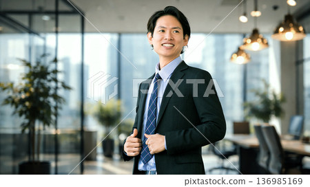 Motivated male businessman in a suit Motivated male businessman in a suit 136985169