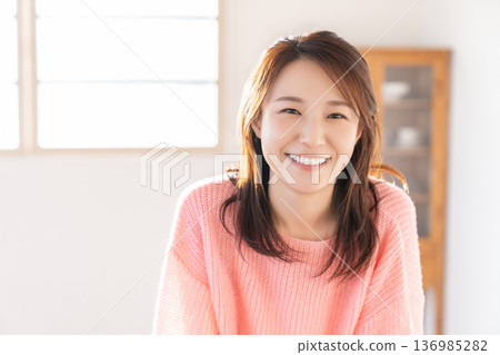 A young woman relaxing in the room 136985282