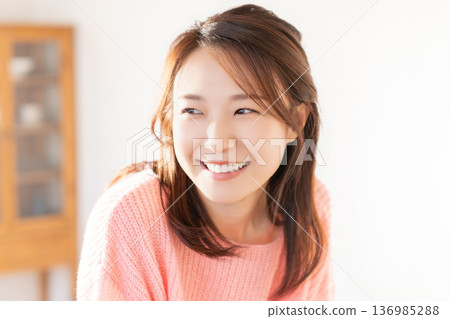 A young woman relaxing in the room 136985288