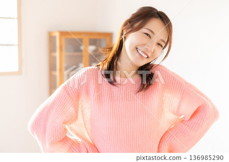 A young woman relaxing in the room 136985290