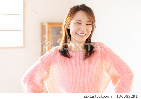 A young woman relaxing in the room 136985291