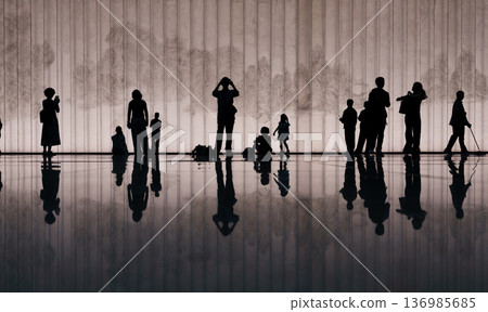 Silhouettes and reflections of people standing in a modern exhibition space Silhouettes and reflections of people standing in a modern exhibition space 136985685