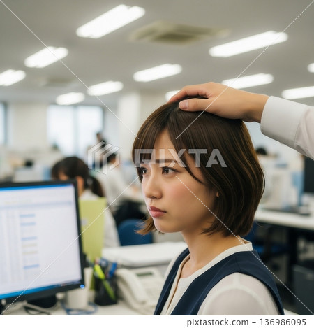 A male employee sexually harasses a young female employee by touching her head in the company office. 136986095