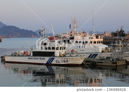 Moored patrol boat Moored patrol boat 136986926