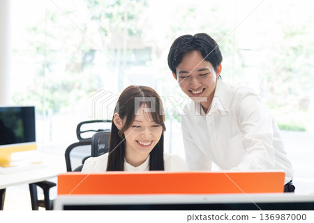 Students at a computer Students at a computer 136987000