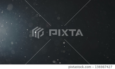 background of floating particles in air over black background and lens flare background of floating particles in air over black background and lens flare 136987427