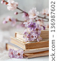 Interior photo of a table with lavender and old books 136987602