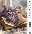 Interior photo of a table with lavender and old books 136987603