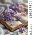 Interior photo of a table with lavender and old books 136987604