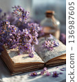 Interior photo of a table with lavender and old books 136987605