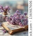 Interior photo of a table with lavender and old books 136987606