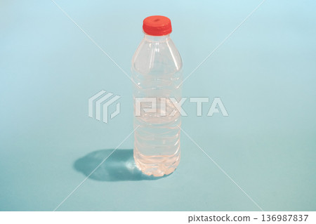 Plastic Water Bottle on a Minimalist Pastel Blue Background 136987837