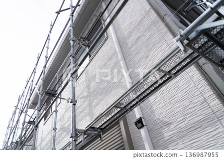 Example of a typical house: Scaffolding has begun at the exterior wall repair site Example of a typical house: Scaffolding has begun at the exterior wall repair site 136987955