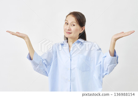Elderly woman giving up on white background 136988154
