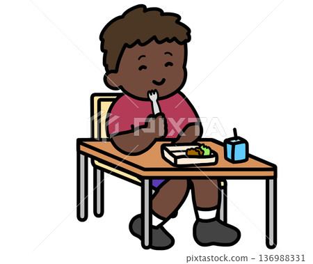 Black boy eating lunch with a fork in classroom Black boy eating lunch with a fork in classroom 136988331