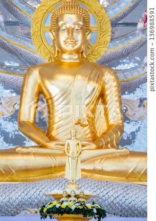 Golden Buddha statue serves as a symbol for the Lord Buddha. for adoration and reverence among Buddhists Golden Buddha statue serves as a symbol for the Lord Buddha. for adoration and reverence among Buddhists 136988591