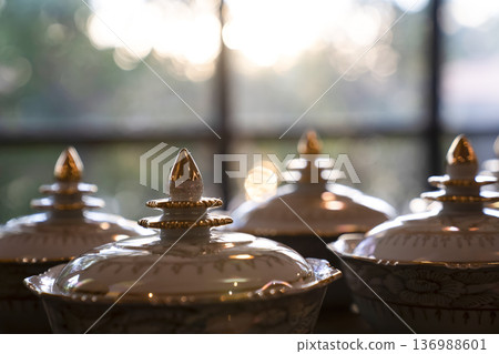Thai bowl set on table prepare for give food offerings to a Buddhist monk in the morning. People usually prepare rice, dishes and flower offer food to monk. 136988601