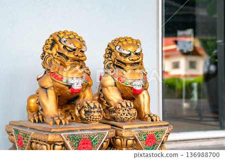 Chinese golden god lion statue is the Asia zen structure ornament emperor in front of the door to protect the bad thing come in. 136988700