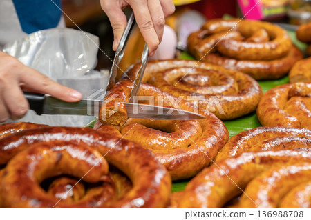 Sai Aua, Northern Thailand Spicy Sausage is a famous Traditional Local saurage cooked with curry and herb, lay on shop and ready for sales. 136988708