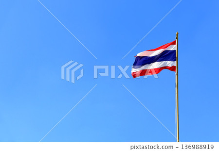 Flag of Thailand on clear sky background. Thailand Flag Waving in Wind on Flagpole. Copy space for text 136988919