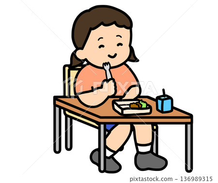 Asian girl eating lunch with a fork in the classroom Asian girl eating lunch with a fork in the classroom 136989315