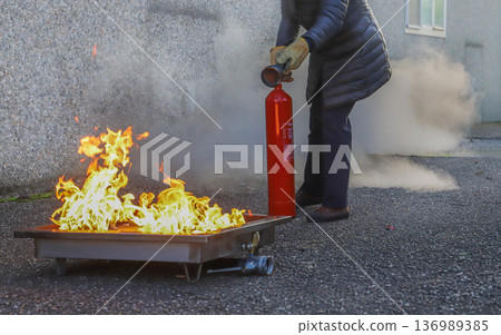 corporate safety - exercise during a firefighting course 136989385