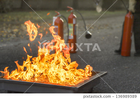 corporate safety - exercise during a firefighting course 136989389