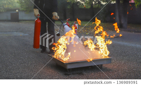 corporate safety - exercise during a firefighting course 136989391