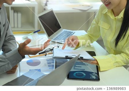 Financial analysis business financial meeting with document and tablet on the table 136989983