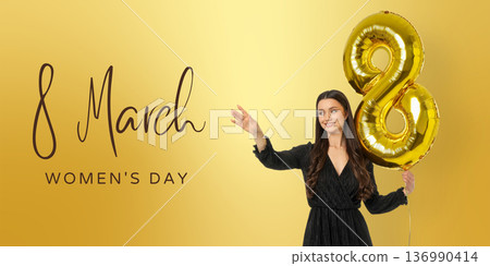 Young woman holds a golden balloon shaped like 8 136990414