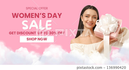 A woman holds a gift box while smiling for Women's Day A woman holds a gift box while smiling for Women's Day 136990420