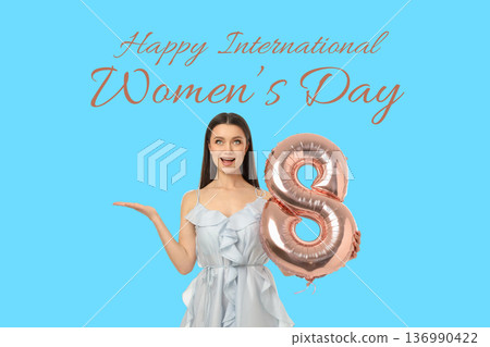 A young woman celebrates Women's Day holding a balloon A young woman celebrates Women's Day holding a balloon 136990422