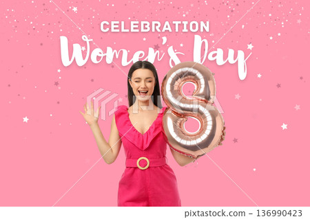 Young woman celebrates Women's Day with a balloon Young woman celebrates Women's Day with a balloon 136990423