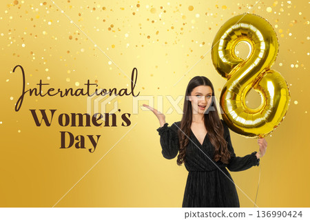 Young woman holds golden balloon for Women Day 136990424