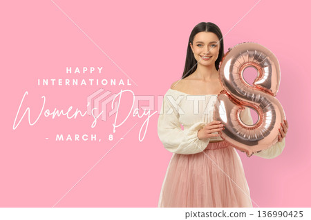 A woman holds a balloon number 8 and smiles for Women's Day A woman holds a balloon number 8 and smiles for Women's Day 136990425