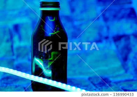 Black plastic bottle for detergents,shampoo in blue light Black plastic bottle for detergents,shampoo in blue light 136990433