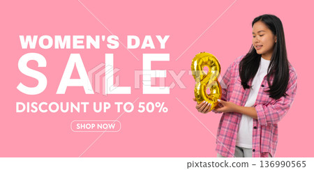 A young woman holds a golden number 8 while promoting a sale A young woman holds a golden number 8 while promoting a sale 136990565