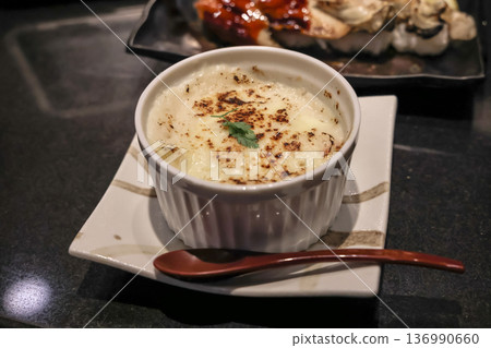 Nov 24 2025 Creamy Cheese Gratin In Ramekin On Square Plate With Garnish Nov 24 2025 Creamy Cheese Gratin In Ramekin On Square Plate With Garnish 136990660