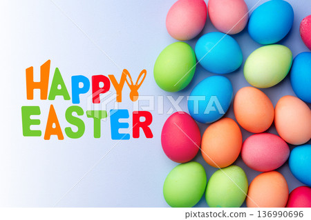 Colorful eggs and happy easter greeting on light background for holiday celebration Colorful eggs and happy easter greeting on light background for holiday celebration 136990696