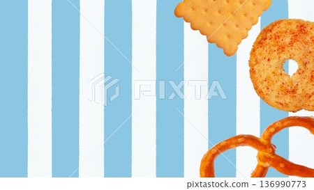 Colorful snacks on a blue and white striped background for Easter celebration enjoyment Colorful snacks on a blue and white striped background for Easter celebration enjoyment 136990773