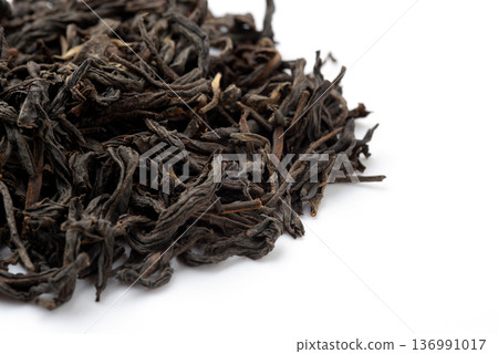 Pile of black tea on white background. Pile of black tea on white background. 136991017
