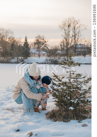 Mother and Baby in Winter Wonderland Mother and Baby in Winter Wonderland 136991686