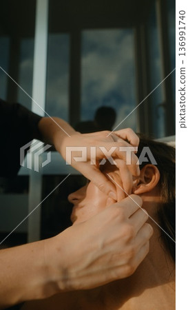 Intimate setting where therapist provides reassuring gentle hand contact 136991740