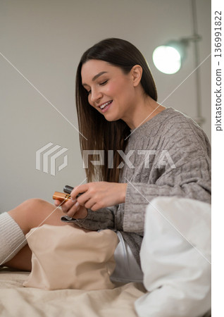 Smiling young woman looking happy and joyful Smiling young woman looking happy and joyful 136991822